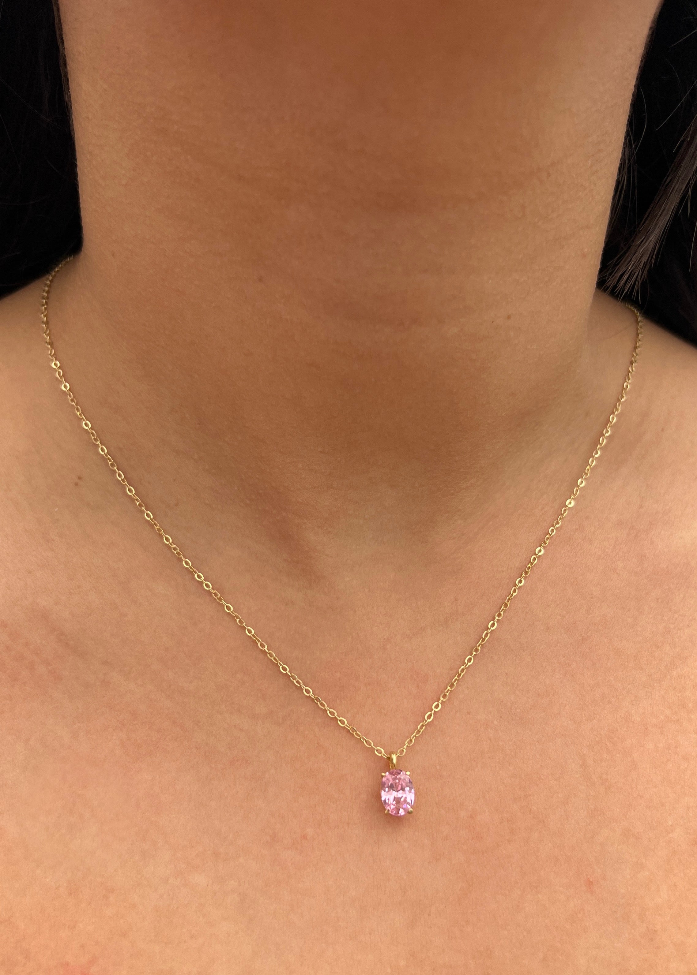 Dije con swarovski rosado 1gr / Largo 1cm / Oro Amarillo Nac M