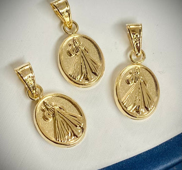 Dije jesus de la misericordia. 1.1gr / Largo 2.5cm / Oro Amarillo Nac P