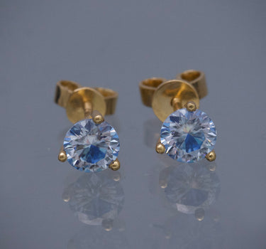 Topos con 90pts de moissanita azul 1.5gr / Largo 0.54cm / Oro Amarillo (Joya) B
