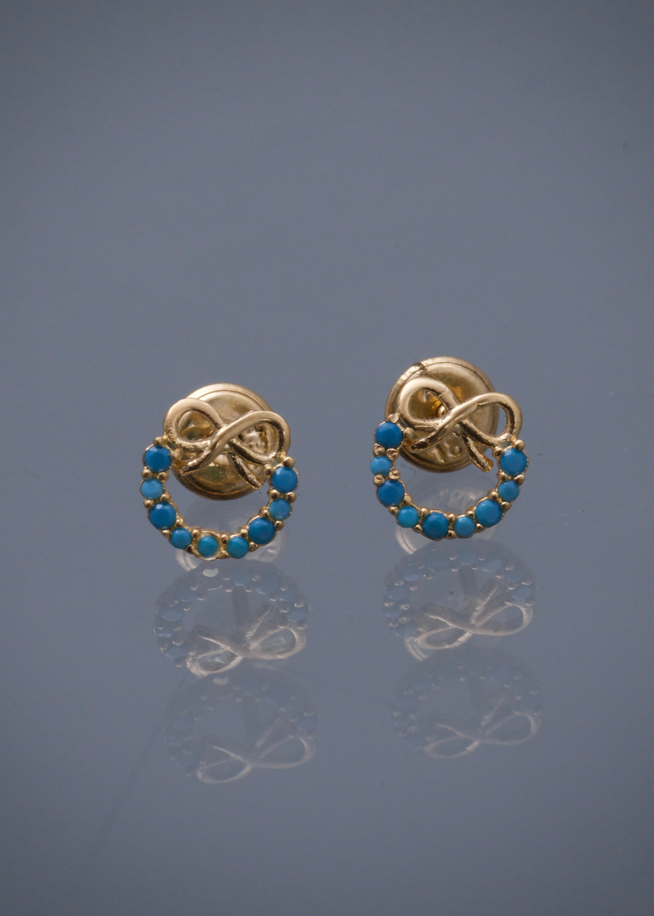 Topos de moño con swarovski azul 0.9gr / Largo 0,74cm / Oro Amarillo Nac B