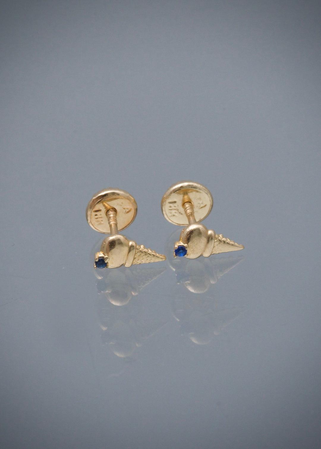 Topos helado con swarovski azul 0.7gr / Largo 0.7cm — Oro Amarillo