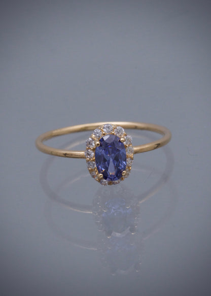 Solitario ovalado con swarovski morado y blanco 1.4gr / Talla 6 1/2 / Oro Amarillo Nac B