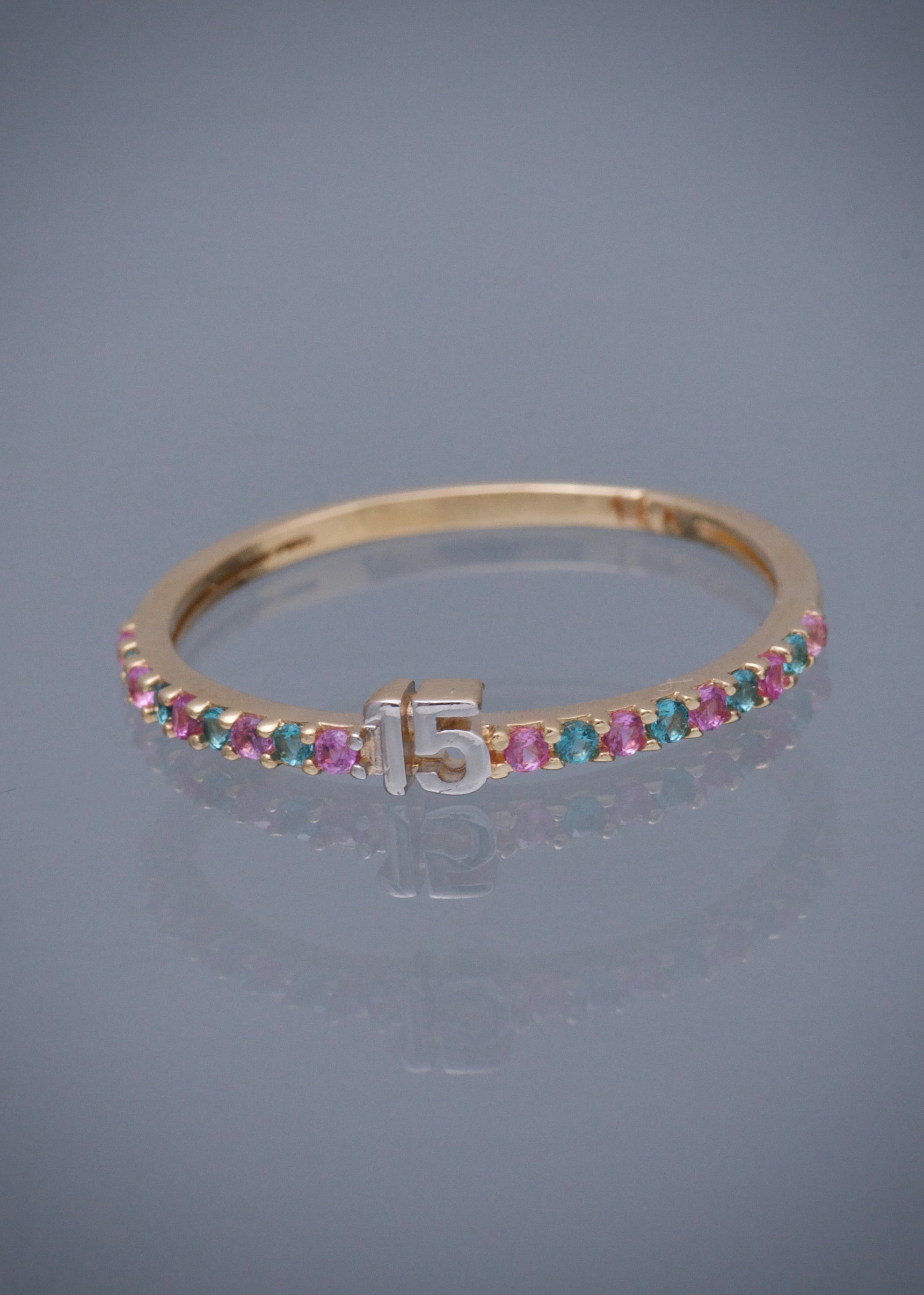 Anillo de 15s con swarovski rosado y azul 1.25gr / TALLA 7 / Oro Amarillo Nac M