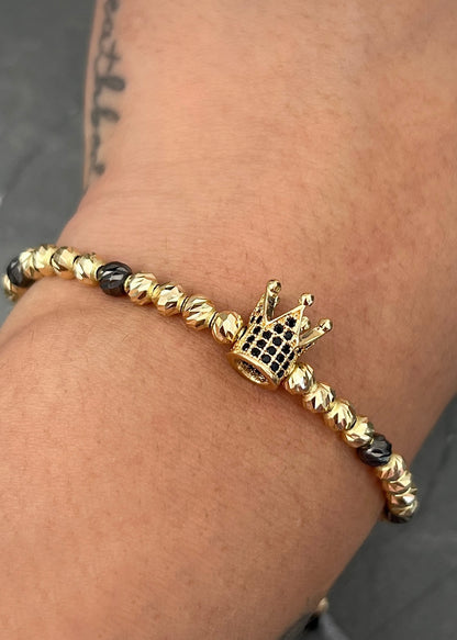 Pulsera en hilo negro con herraje de corona 5.05gr / Oro Amarillo (Joya) M
