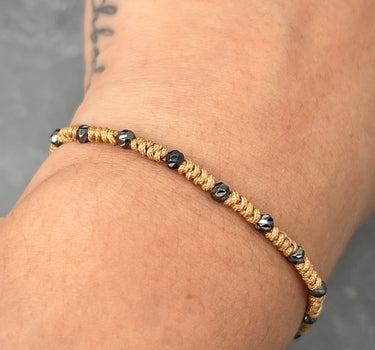 Pulsera en hilo cafe con bolas diamantadas 0.85gr  (Joya) M