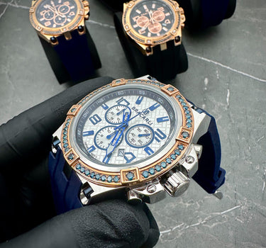 Reloj Bracarli Metal II. Oro Rosado 18k 8.0gr Con 1.75Qts (175Pts) De Diamante Azul Caja Blanca , Fondo Blanco Y Correa Azul M