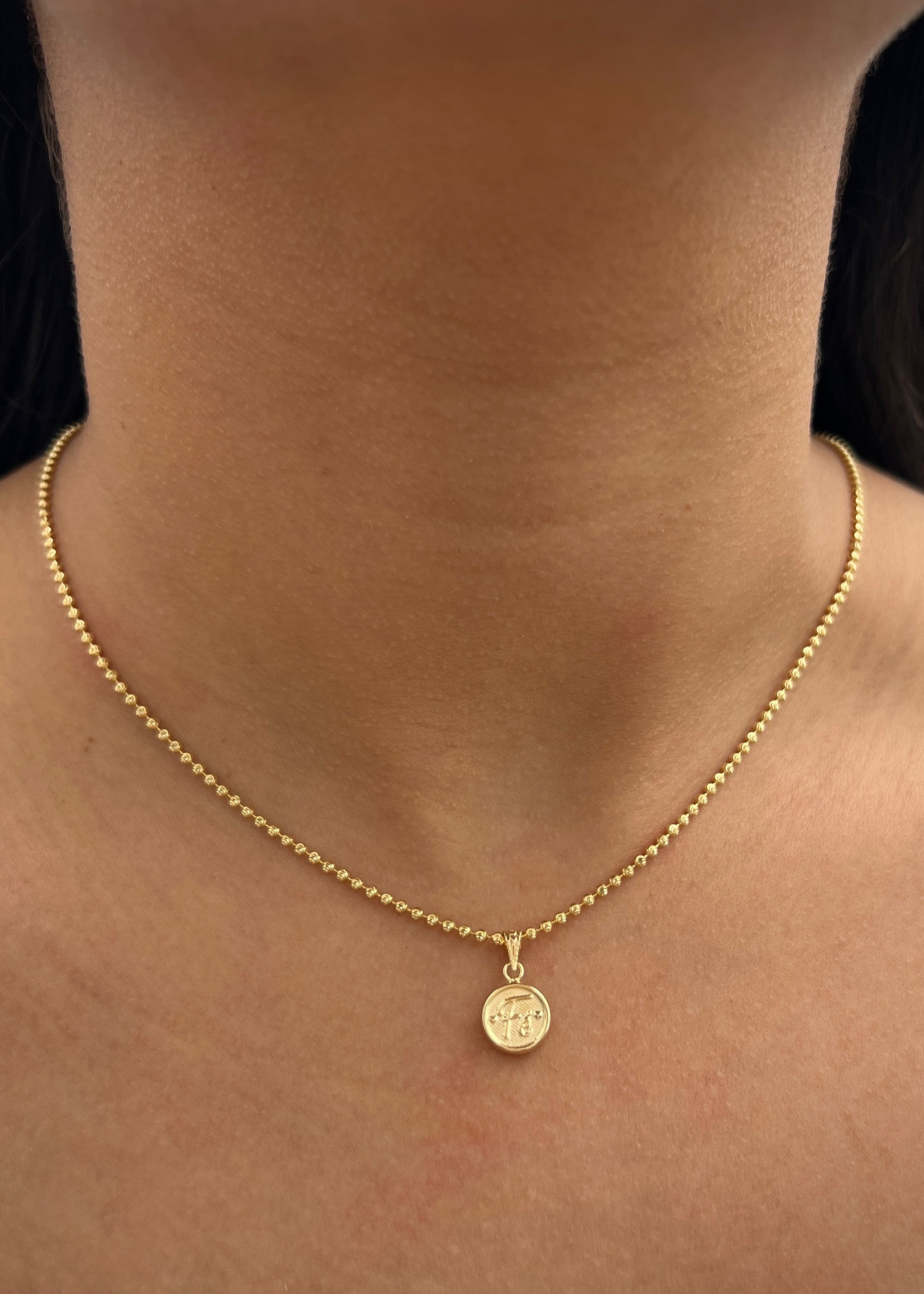 Dije fe 0.5gr / Largo 1.5cm / Oro Amarillo Nac P
