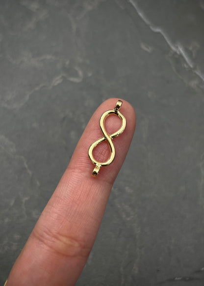 Herraje infinito 0.3gr / Largo 2,3cm / Oro Amarillo Nac B