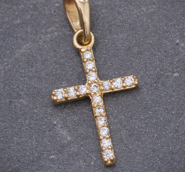 Dije cruz con swarovski blanco 0.6gr / Largo 2.1cm / Oro Amarillo Nac B
