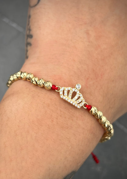 Pulsera en hilo rojo con herraje corona 3.05gr / Oro Amarillo (Joya) M
