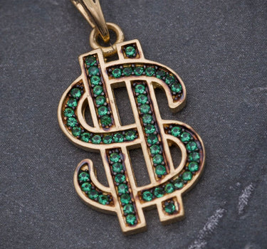 Dije signo peso con swarovski verde 3.05gr / Largo 2.7cm / Oro Amarillo Nac B
