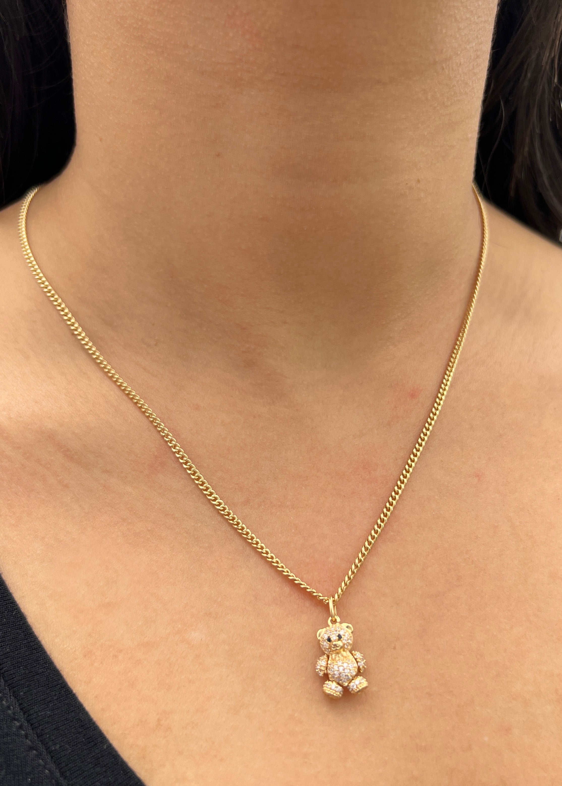 Dije oso articulado con swarovski blanco 2.65gr / Largo 2cm / Oro Amarillo Nac P