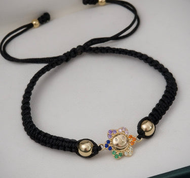 Pulsera en hilo negro con herraje flor 1.25gr / Oro Amarillo (Joya) M