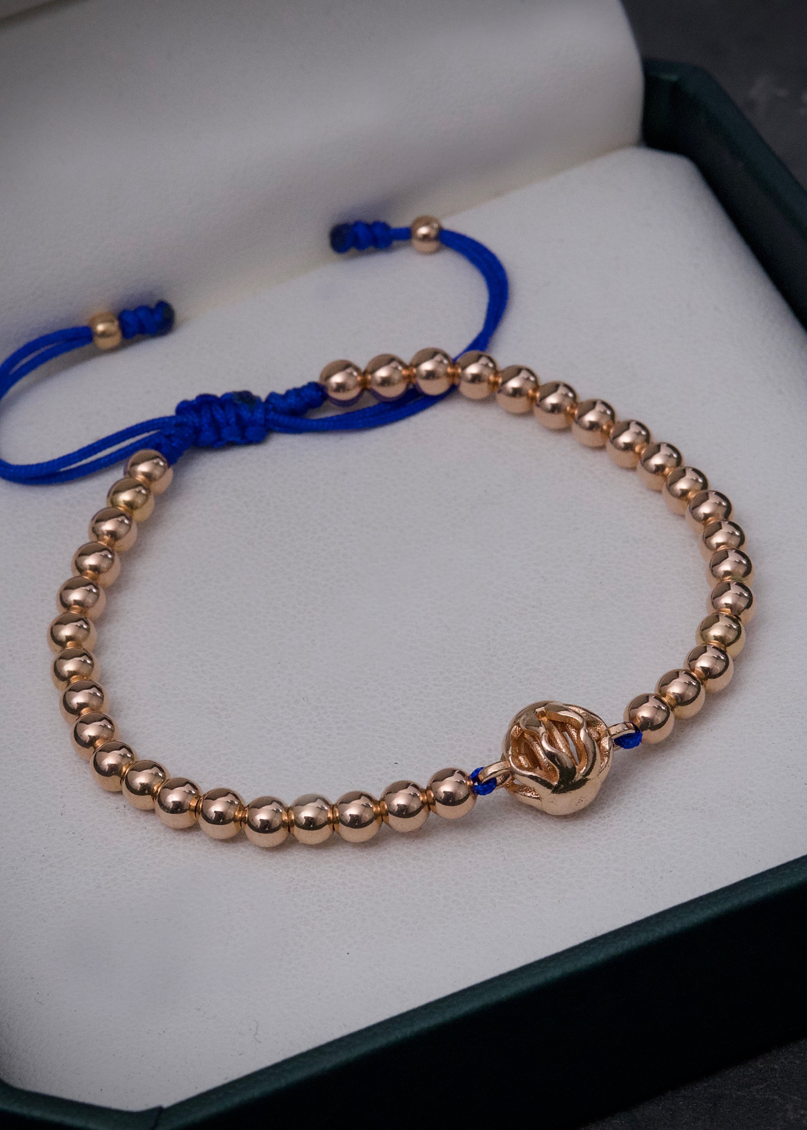 Pulsera en hilo azul con herraje de sol 5.45gr / Oro Rosado (Joya) M