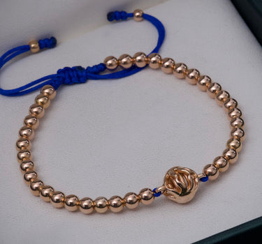 Pulsera en hilo azul con herraje de sol 5.45gr / Oro Rosado (Joya) M