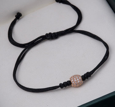 Pulsera en hilo negro con herraje 0.95gr / Oro Rosado (Joya) M