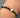 Pulsera en hilo negro con herraje san benito 0.65gr / Oro Amarillo (Joya) M