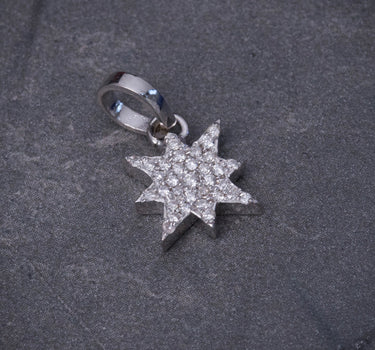 Dije estrella con 18pts de diamantes 1.6gr / Largo 1.5cm / Oro Blanco Nac (Joya) P