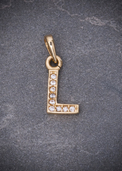 Dije letra L con swarovski blanco 0.55gr / Largo 1.5cm / Oro Amarillo Nac B