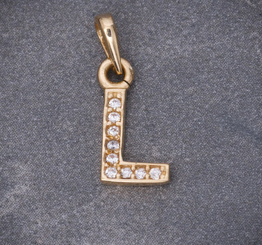 Dije letra L con swarovski blanco 0.55gr / Largo 1.5cm / Oro Amarillo Nac B