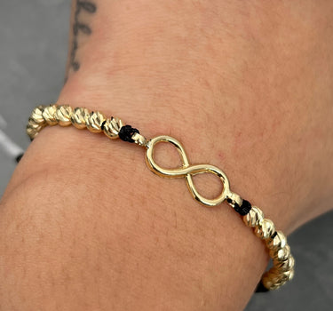 Pulsera en hilo negro con herraje infinito 1.95gr / Oro Amarillo (Joya) M