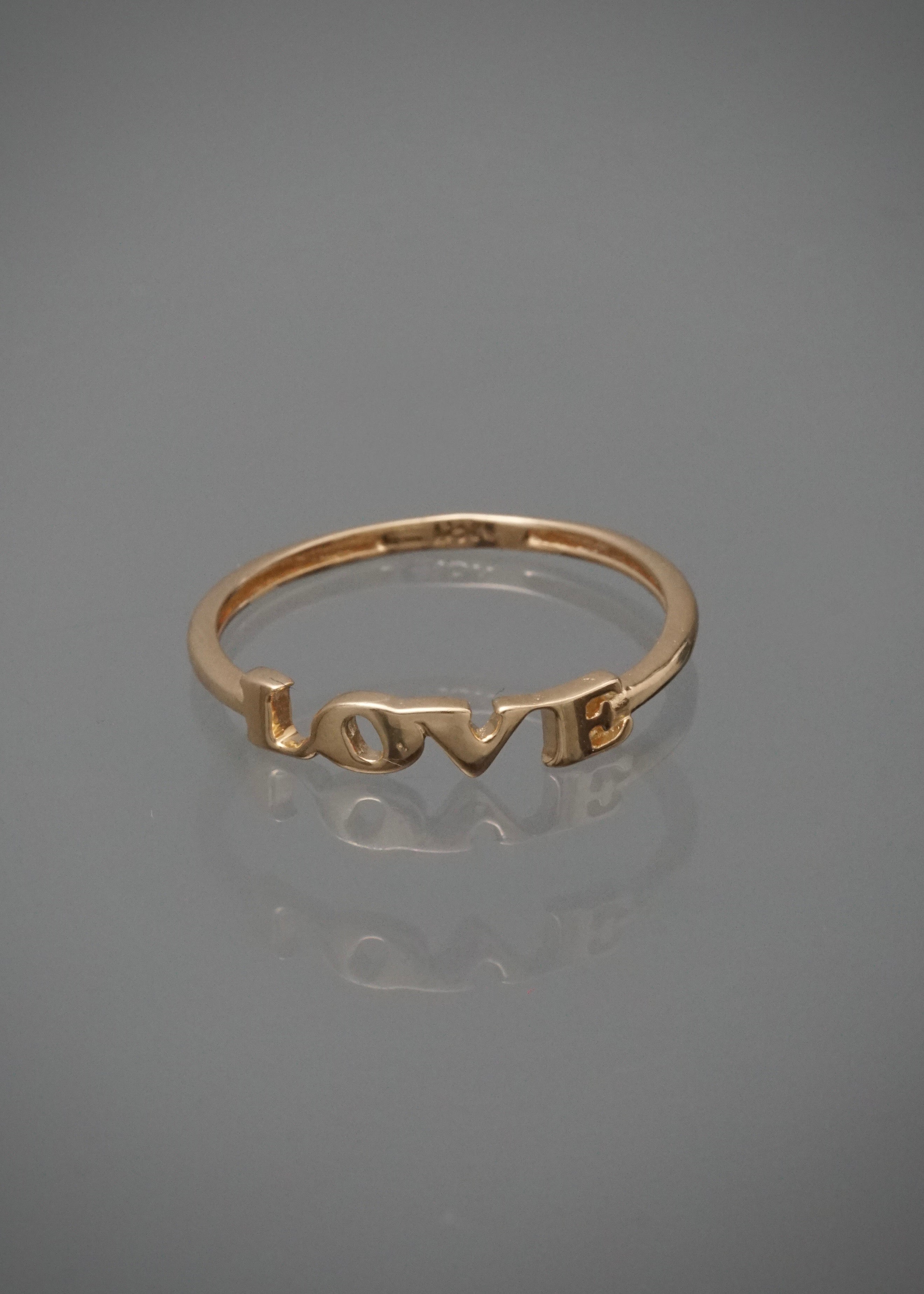Anillo love 1.25gr / Talla 7 1/2 / Oro Amarillo Nac M