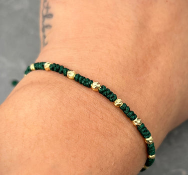 Pulsera en hilo verde con bolas diamantadas 0.85gr / Oro Amarillo (Joya) M