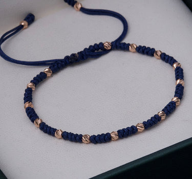 Pulsera en hilo azul con bolas diamantadas 0.85gr / Oro Rosado (Joya) M