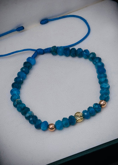Pulsera en hilo azul con bolas lisas / diamantada y apatita 0.3gr / Dos Oros (Joya) M