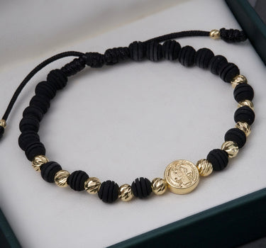 Pulsera en hilo negro con herraje san benito 1.95gr / Oro Amarillo (Joya) M