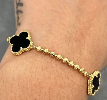 Pulso lucky clover piedra negra 9.3gr / Largo 18cm / Oro Amarillo Nac B