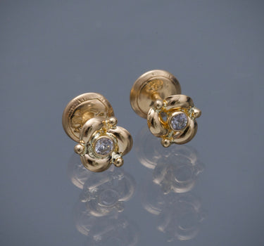 Topos flor con swarovski blanco 0.85gr / Largo 0.6cm / Oro Amarillo Nac B