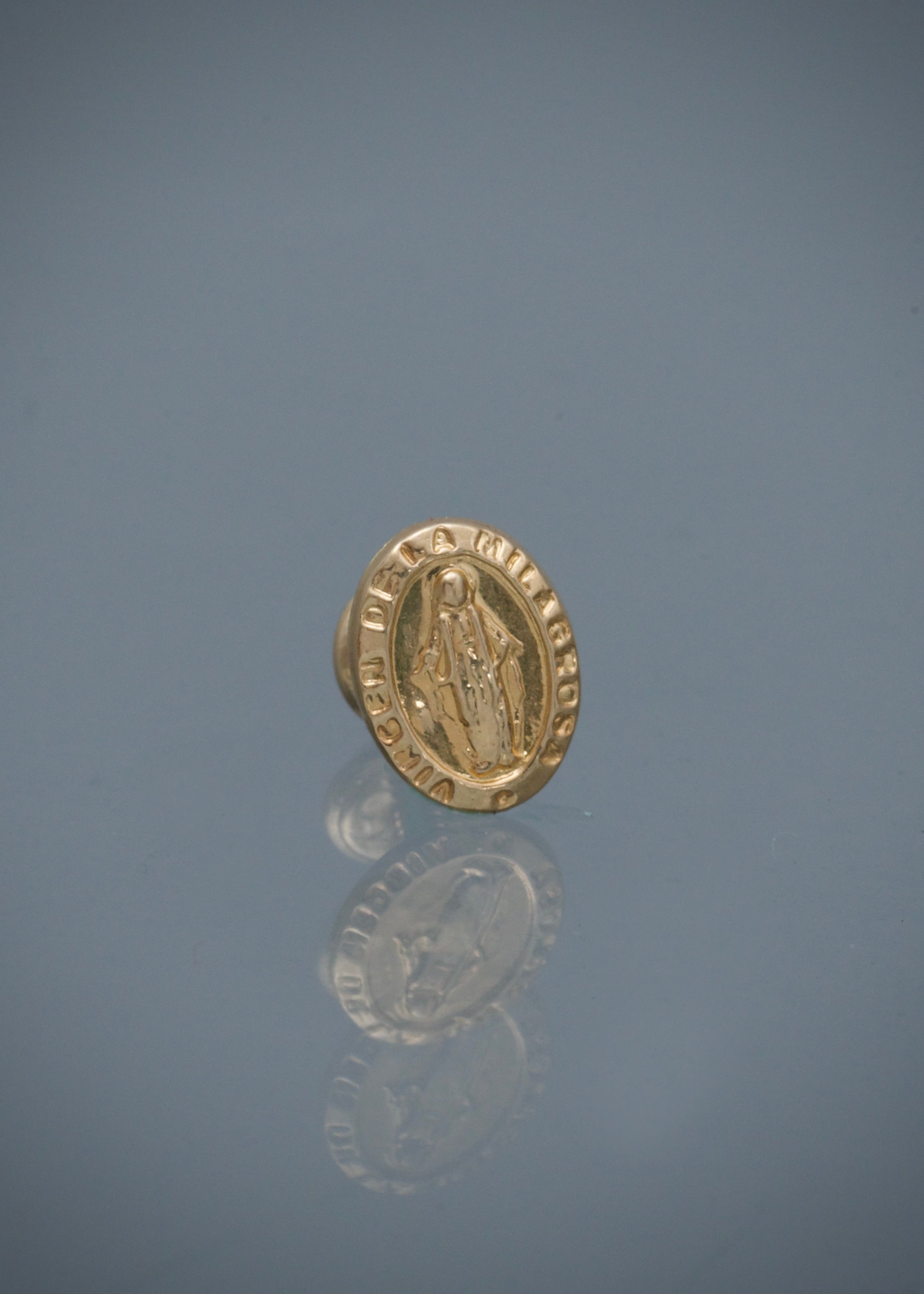 Unidad de topo virgen de la milagrosa 0.5gr / Largo 1 cm / Oro Amarillo Nac B