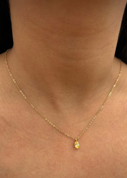 Dije con swarovski amarillo 0.4gr / Largo 0.9cm / Oro Amarillo Nac M