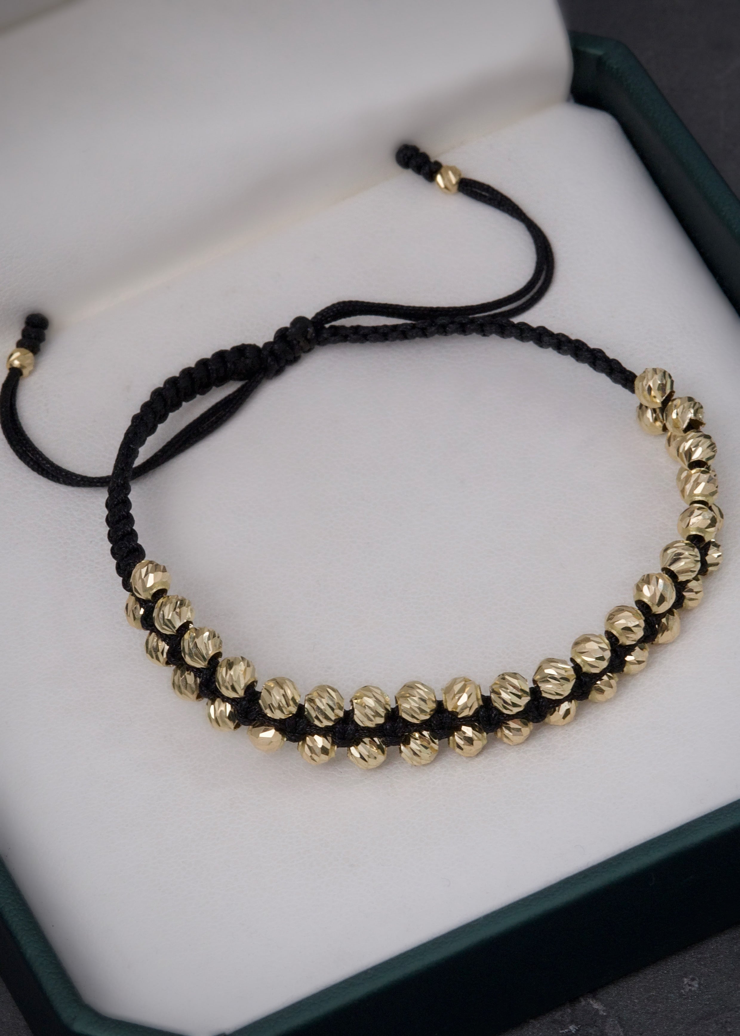 Pulsera en hilo negro con bolas diamantadas 3.7gr / Oro Amarillo Nac (Joya) P