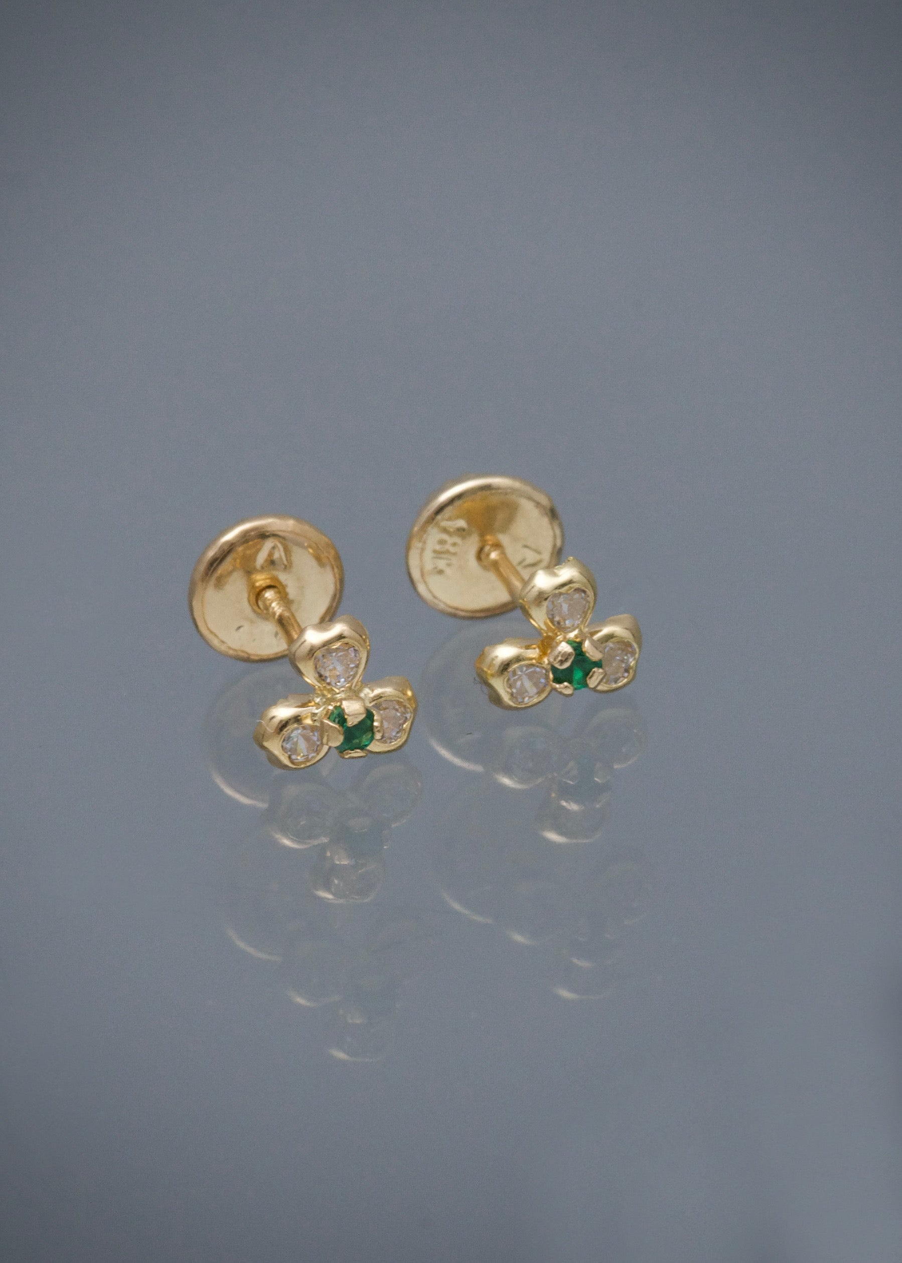Topos flor con swarovski verde y blanco 0.6gr / Largo 0.5cm / Oro Amarillo Nac P