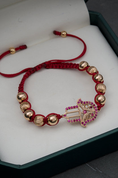 Pulsera de hilo rojo con herraje de mano hamsa y bolas diamantadas  5.3gr / Oro Rosado (Joya) M
