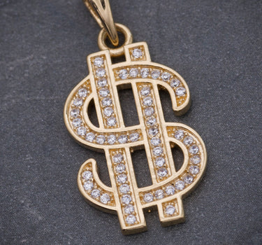Dije signo peso con swarovski blanco 3.2gr / Largo 2.7cm / Oro Amarillo Nac B