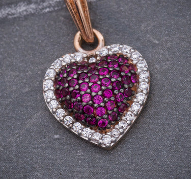 Dije corazon con swarovski fucsia y blanco 1.6gr / Largo 1.9cm / Oro Rosado Nac B