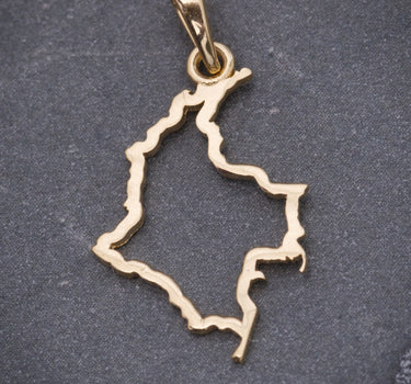 Dije mapa 0.85gr / Largo 2.5cm / Oro Amarillo Nac M