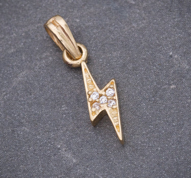 Dije rayo con swarovski blanco 0.6gr / Largo 1.8cm / Oro Amarillo Nac M