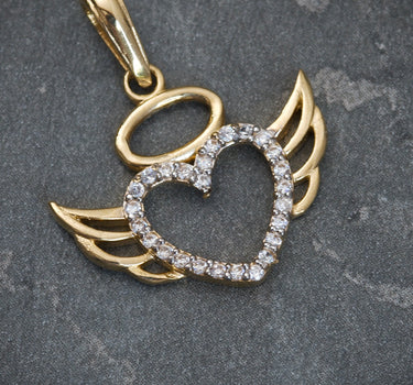 Dije de corazon con alas y swarovski blanco 1.5gr / 2.3cm / Oro Amarillo Nac B