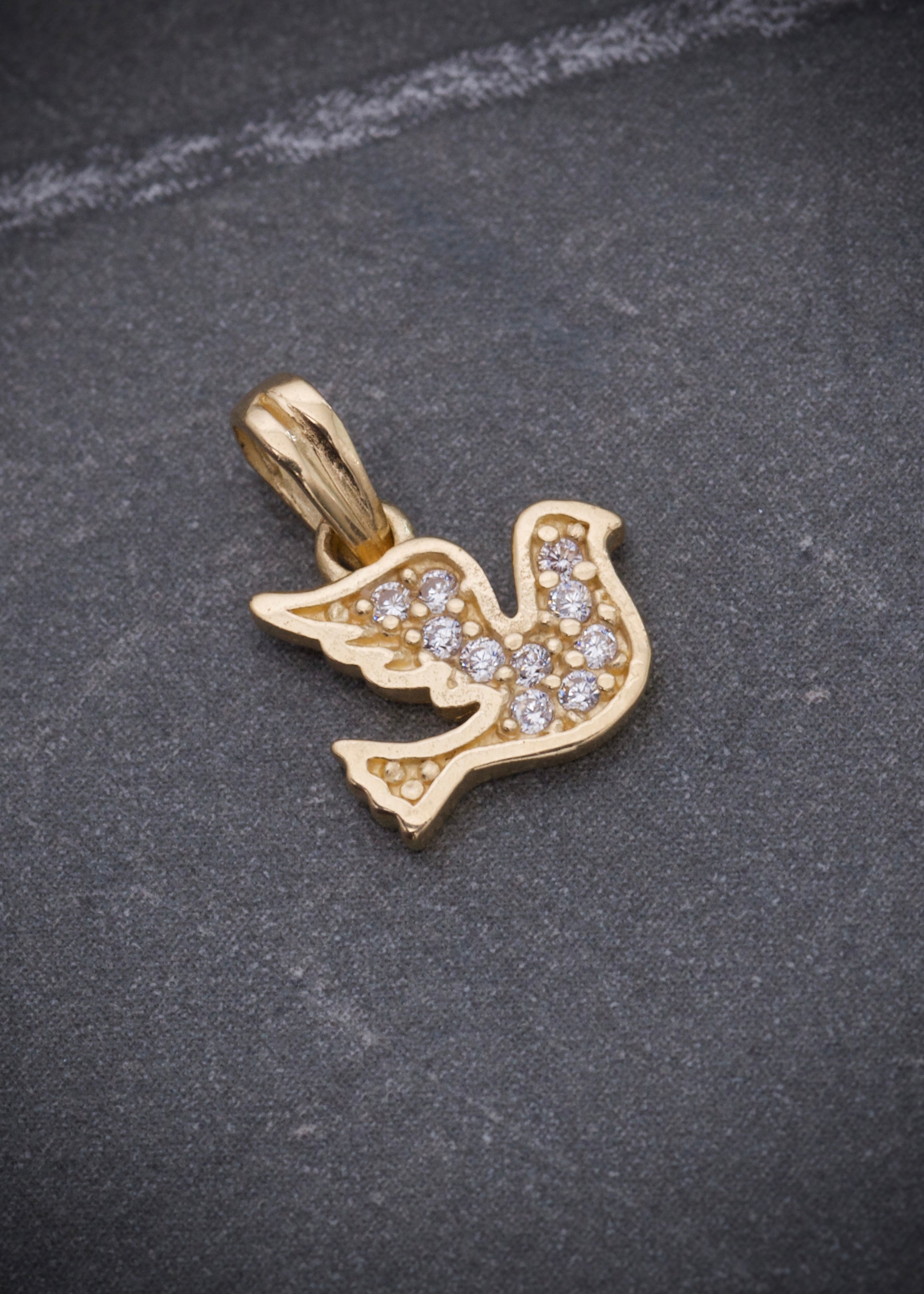 Dije paloma con swarovski blanco 0.8gr / Largo 1.3cm / Oro Amarillo Nac B