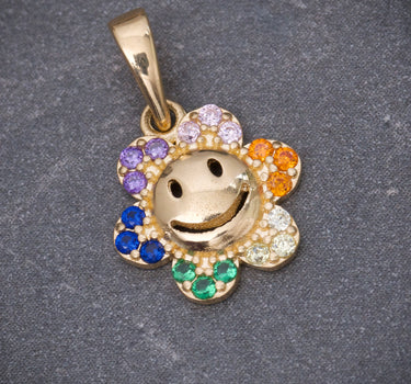 Dije flor con swarovski multicolor 1.05gr / Largo 1.5cm / Oro Amarillo Nac B