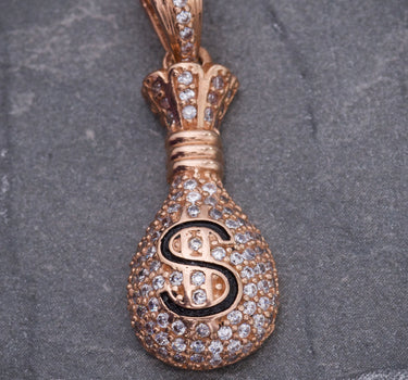 Dije bolsa de dinero con swarovski blanco 3.9gr / Largo 3cm / Oro Rosado Nac M
