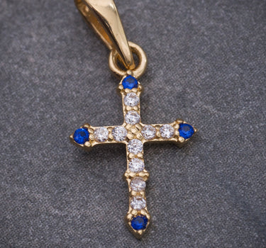 Dije cruz con swarovski azul y blanco 0.5gr / Largo 1.7cm / Oro Amarillo Nac M