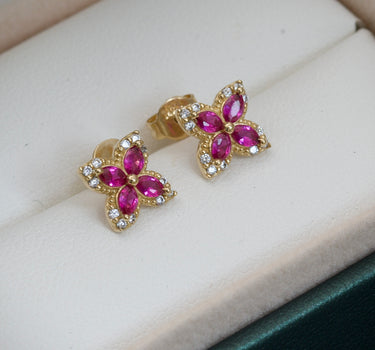 Topos de flor con swarovski fucsia 1.9gr / 1cm / Oro Amarillo Nac B