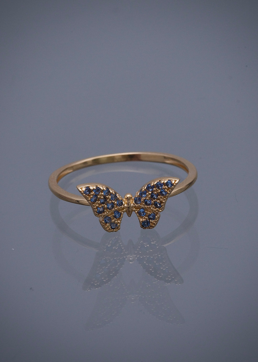 Anillo mariposa con swarovski azul 1.8gr / Talla 8 — Oro Amarillo