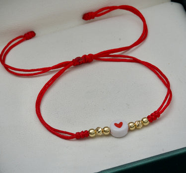 Pulsera en hilo rojo con corazon mas bolas lisas y diamantadas 0.3gr / Oro Amarillo (Joya) M