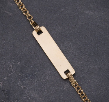Pulso bebe con placa 1.3gr / Largo 13.5cm / Oro Amarillo Nac B
